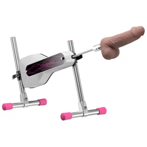 The main product image of the Lovense Mini Sex Machine from TheSexToysIndia, showing the white, app-controlled machine assembled with its metal frame, pink feet, and an attached realistic dildo on the thrusting arm.