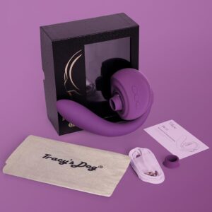 The complete set of the Tracy’s Dog OG 3 Clitoral Sucking Vibrator, showing the purple toy, black retail box, Tracy's Dog branded storage pouch, USB charging cable, and instruction manual. Product from TheSexToysIndia.